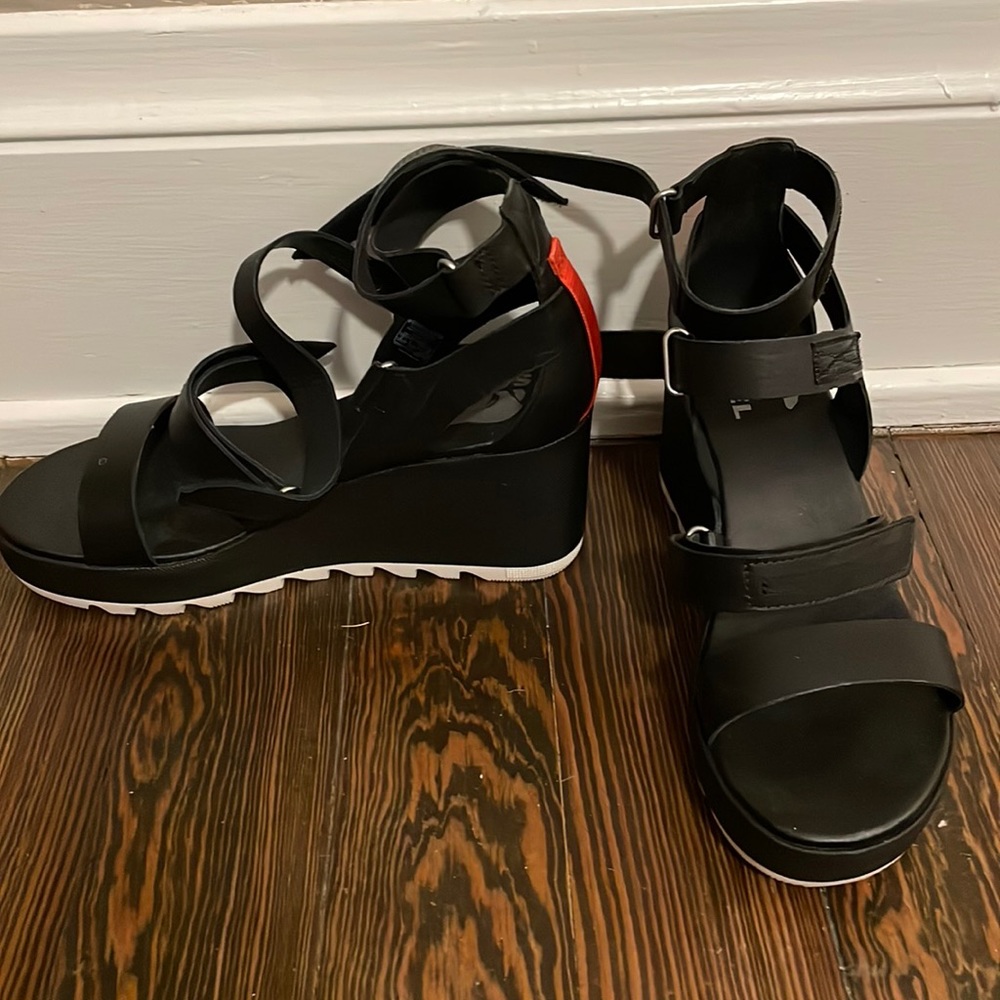 Sorel black wedge sandals.